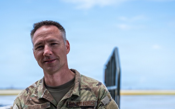 NMCB 1 Sailors and U.S. Airmen load wood cargo for roof restoration operations