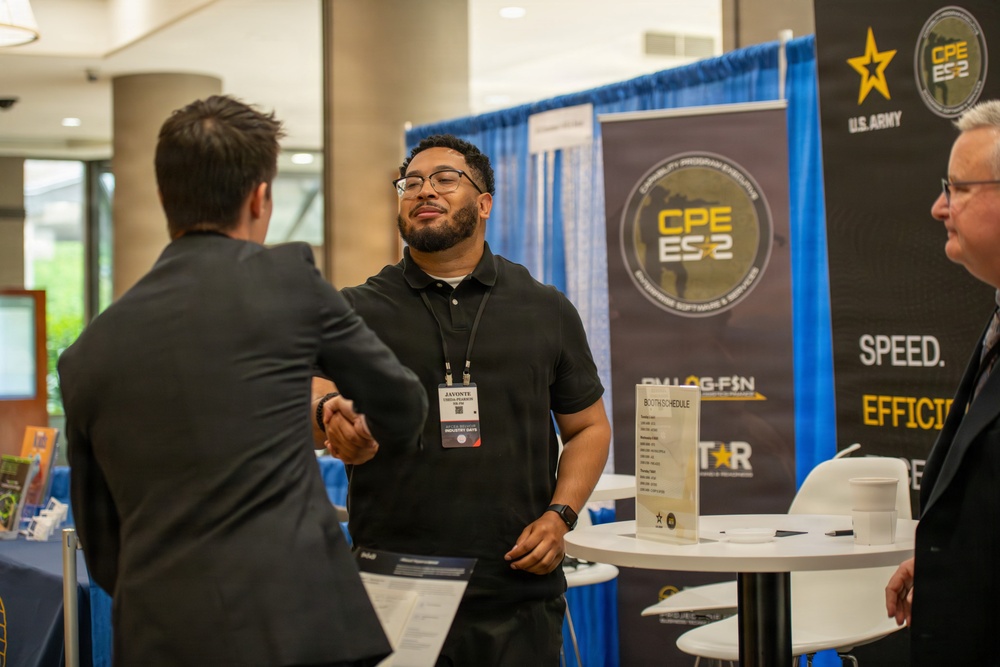 U.S. Army CPE ES2 Representative Greets Attendee at ABID