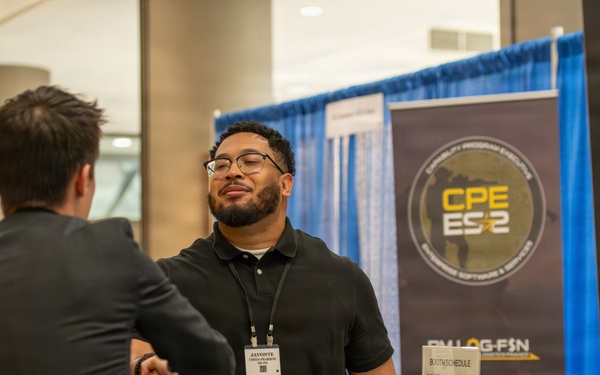 U.S. Army CPE ES2 Representative Greets Attendee at ABID