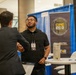 U.S. Army CPE ES2 Representative Greets Attendee at ABID