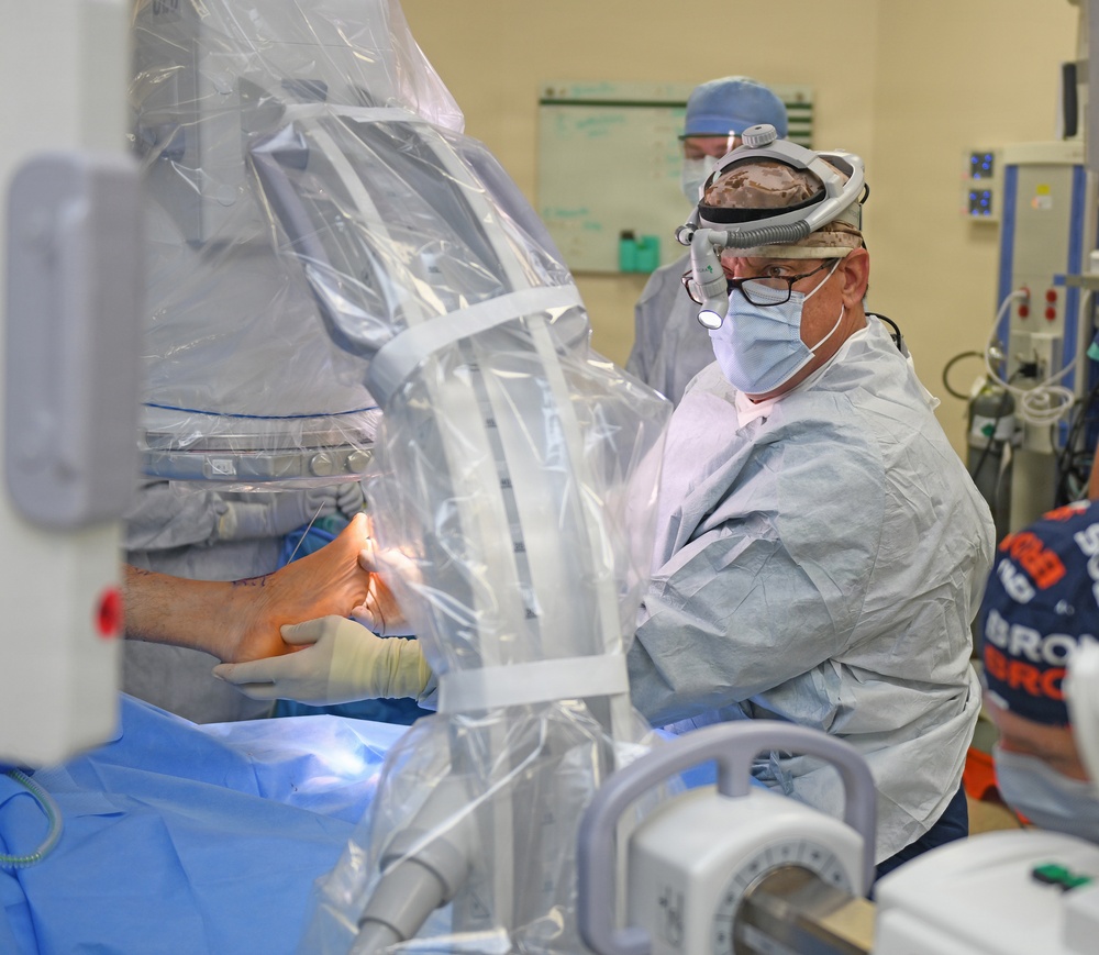 VA surgeon operates on patients in naval facility