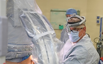 VA surgeon operates on patients in naval facility