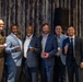 Army Officer and Civilian Leaders Pose with Challenge Coins at ABID 2026
