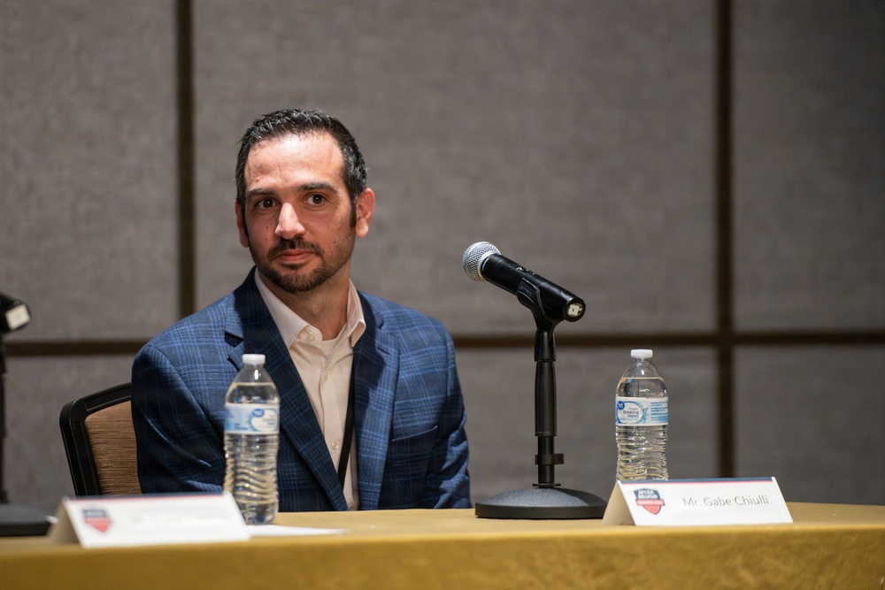 Mr. Gabe Chiulli speaks during panel discussion at AFCEA conference