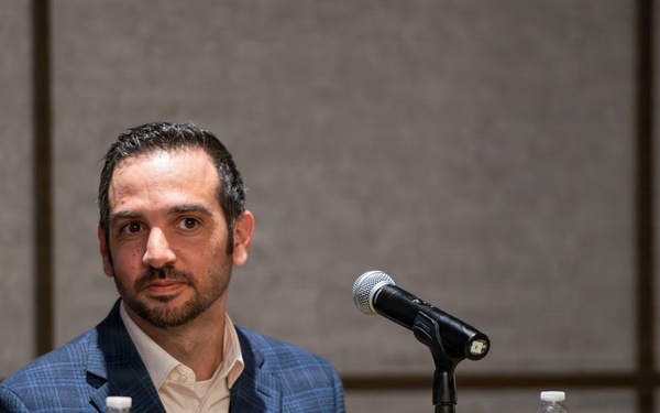 Mr. Gabe Chiulli speaks during panel discussion at AFCEA conference