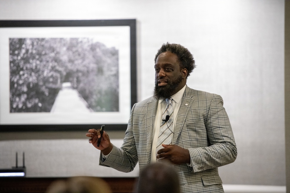 Defense Logistics Agency Speaker addresses audience during conference presentation