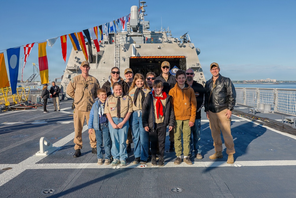 Scouts attend future USS Cleveland morning colors during commissioning week