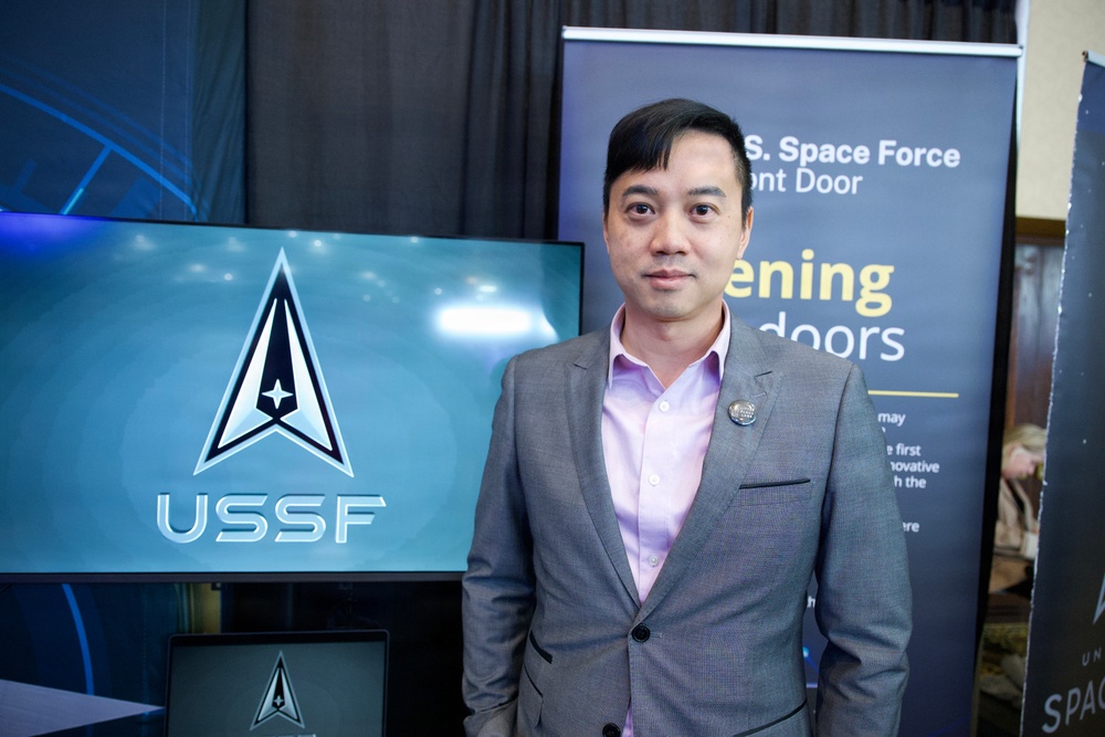 Bosco Lai stops by the Space Force Front Door booth at Space Symposium