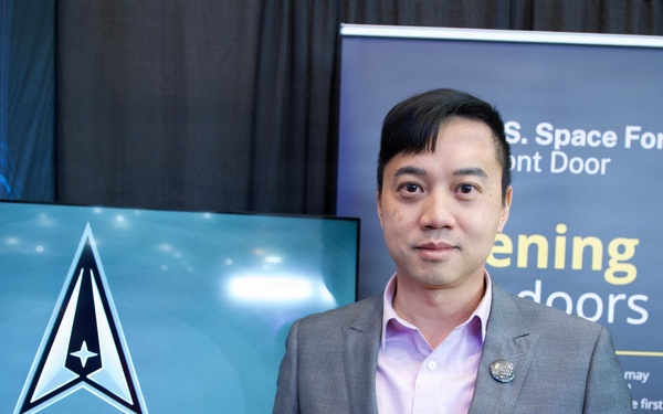Bosco Lai stops by the Space Force Front Door booth at Space Symposium
