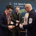 Chief Master Sgt. of the Space Force John F. Bentivegna meets with Space Force Front Door Director Victor Vigliotti and Aerospace’s Joseph Whang during Space Symposium
