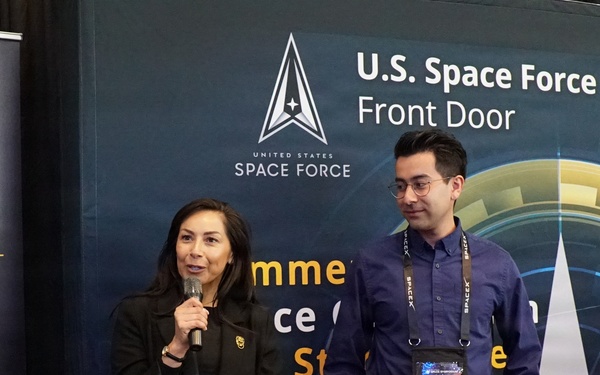 Blanca Nuno and Adrian Torres speak to attendees during Space Symposium
