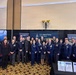 The Space Systems Command leadership team gathers at the Front Door Booth during Space Symposium
