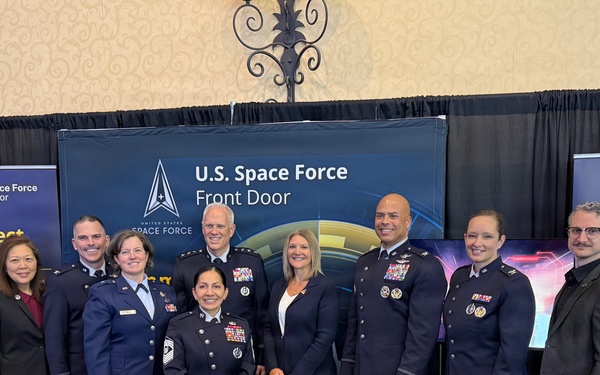 The Space Systems Command leadership team gathers at the Front Door Booth during Space Symposium