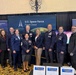 The Space Systems Command leadership team gathers at the Front Door Booth during Space Symposium