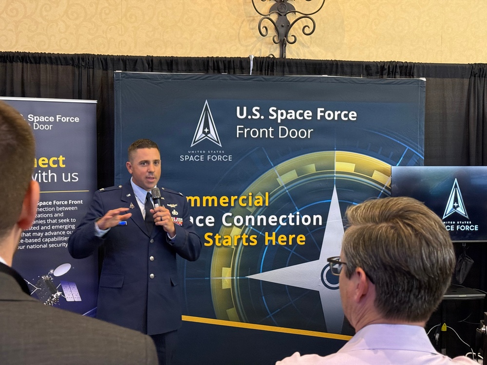 Col. Timothy Trimailo speaks to attendees at Space Symposium