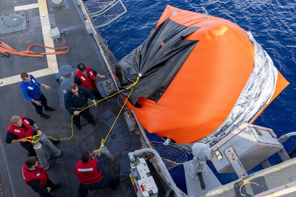 USS Mustin conducts a "killer tomato" inflatable surface target live-fire exercise