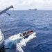 USS Mustin conducts boat operations