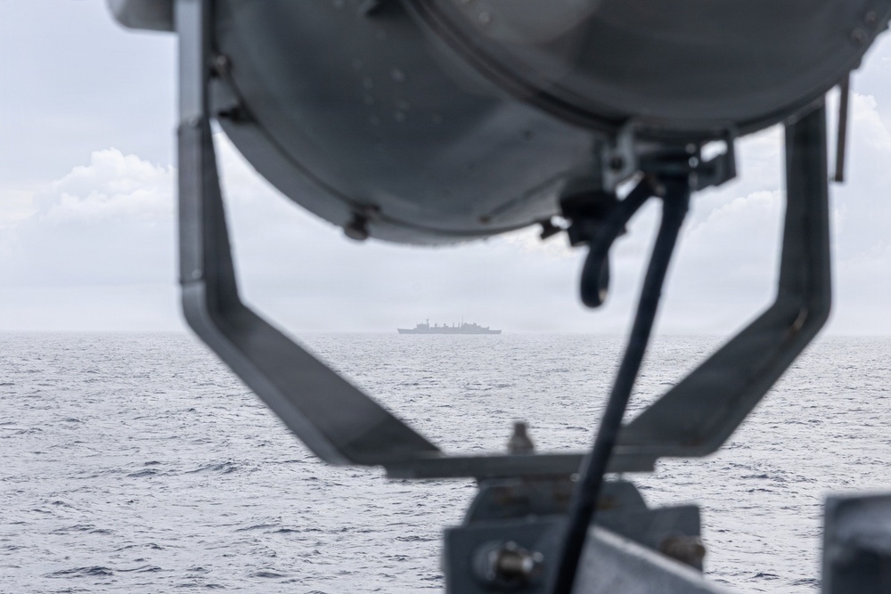 USS Mustin conducts a replenishment-at-sea with USNS Arctic