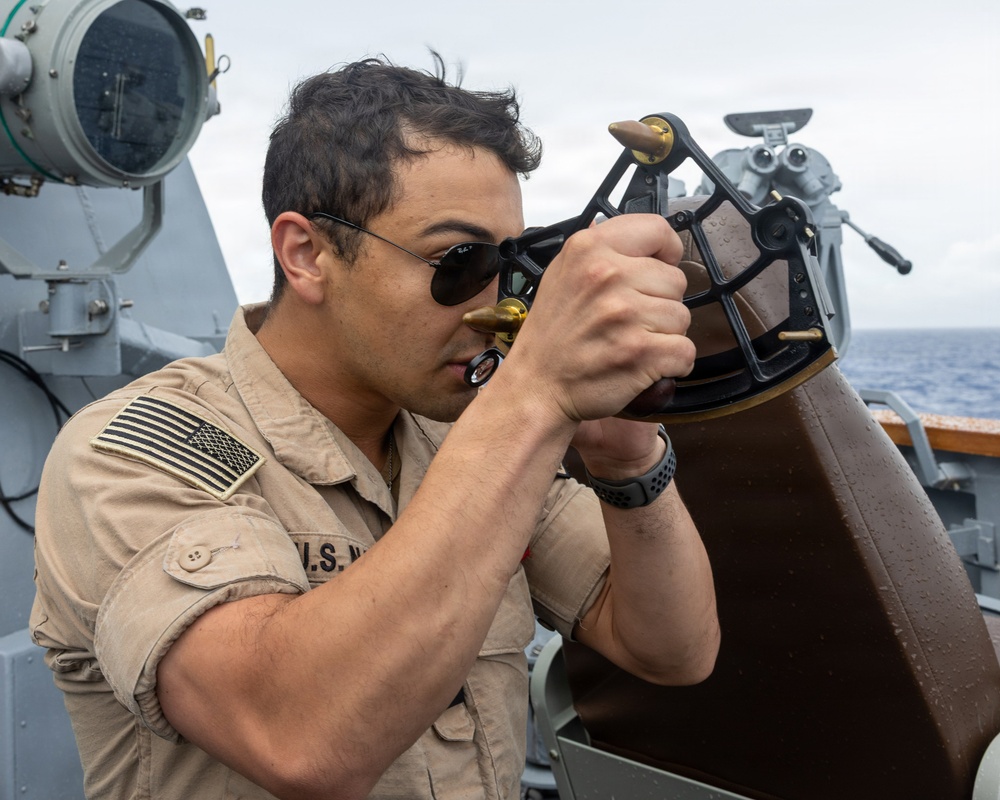 USS Mustin conducts a replenishment-at-sea with USNS Arctic