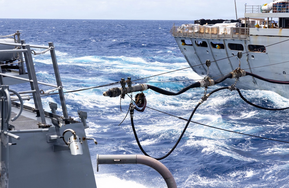 USS Mustin conducts a replenishment-at-sea with USNS Arctic