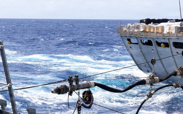 USS Mustin conducts a replenishment-at-sea with USNS Arctic