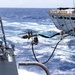 USS Mustin conducts a replenishment-at-sea with USNS Arctic