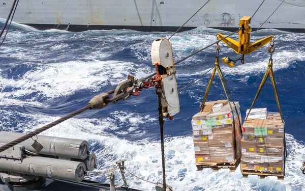 USS Mustin conducts a replenishment-at-sea with USNS Arctic