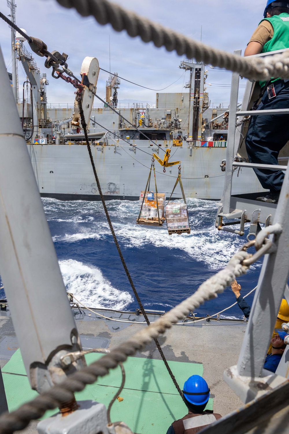 USS Mustin conducts a replenishment-at-sea with USNS Arctic