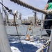 USS Mustin conducts a replenishment-at-sea with USNS Arctic