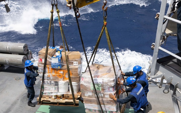 USS Mustin conducts a replenishment-at-sea with USNS Arctic