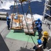 USS Mustin conducts a replenishment-at-sea with USNS Arctic