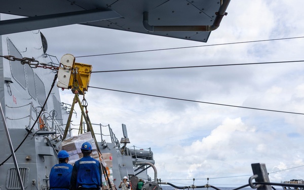 USS Mustin conducts a replenishment-at-sea with USNS Arctic