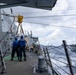 USS Mustin conducts a replenishment-at-sea with USNS Arctic
