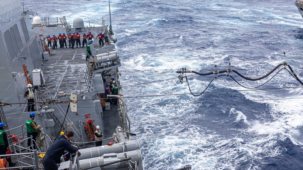 USS Mustin conducts a replenishment-at-sea with USNS Arctic