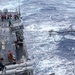 USS Mustin conducts a replenishment-at-sea with USNS Arctic