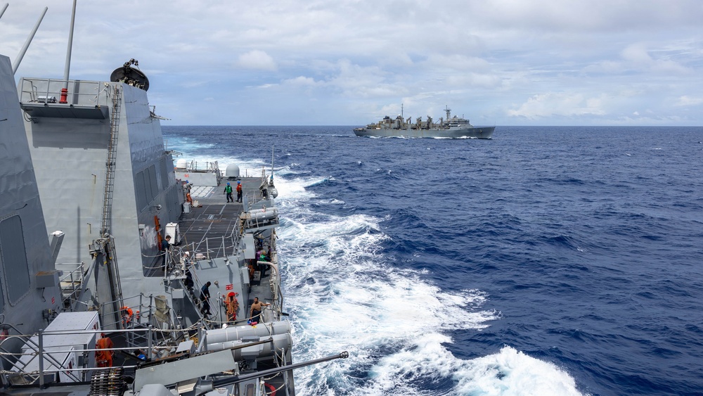 USS Mustin conducts a replenishment-at-sea with USNS Arctic