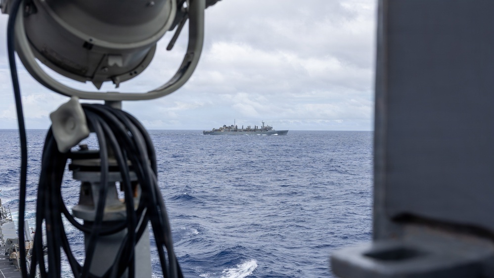 USS Mustin conducts a replenishment-at-sea with USNS Arctic