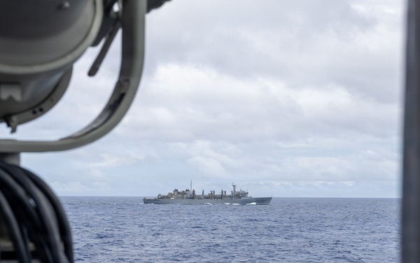 USS Mustin conducts a replenishment-at-sea with USNS Arctic