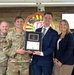 Space Systems Command presents Cadet Squadron 9 with a flag flown in space