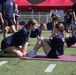 DoWEA Quantico Middle High School students perform curl-ups during the Presidential Physical Fitness Test