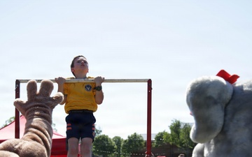 DoWEA Crossroads Elementary School student performs pull-ups during the Presidential Physical Fitness Test