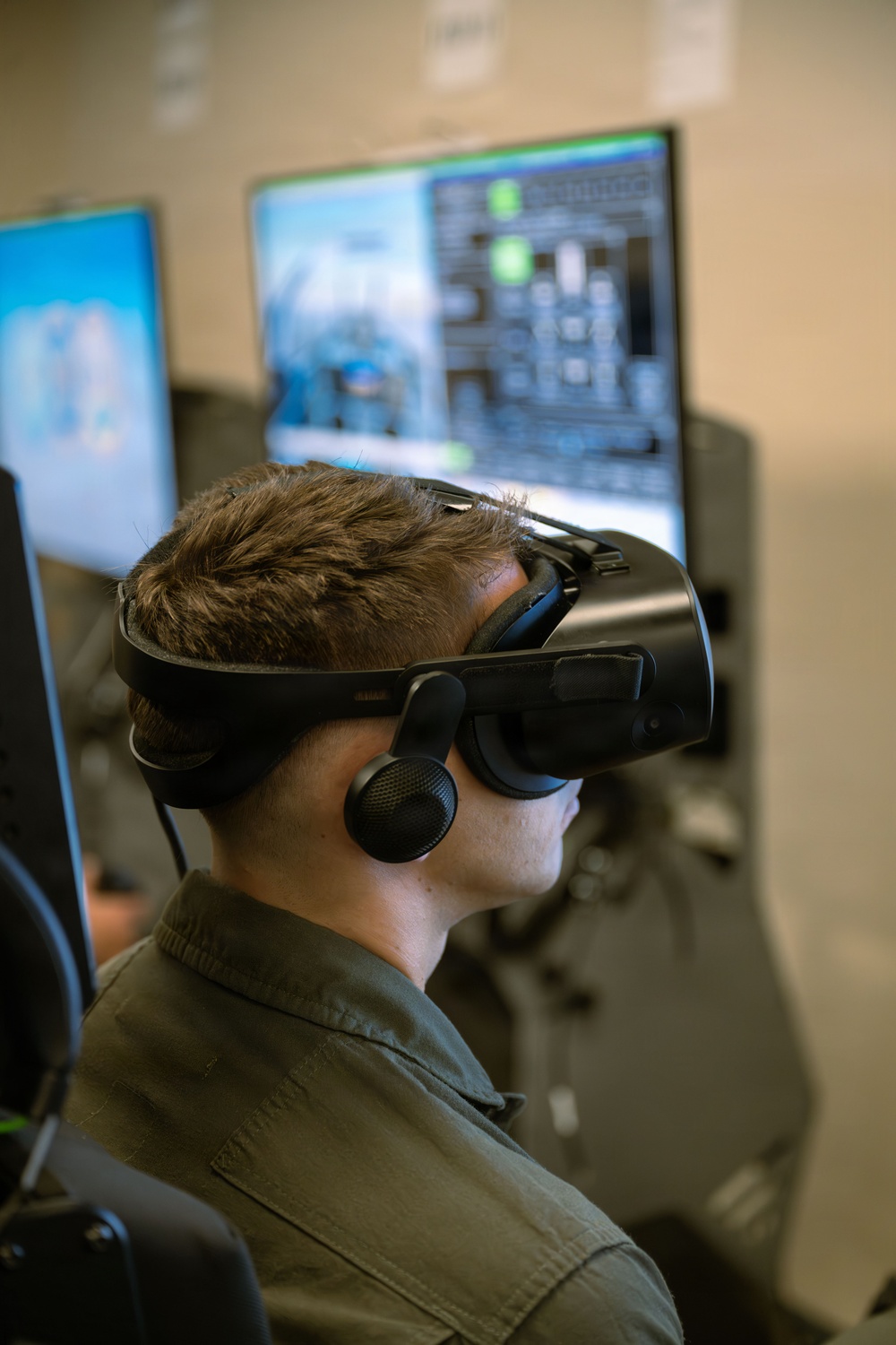 Student Naval Aviator Trains Using Virtual Reality Simulator