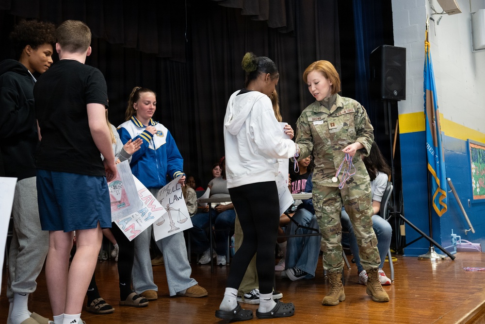 Legal Office Airmen award students during Law Day