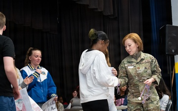 Legal Office Airmen award students during Law Day