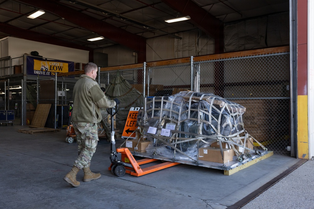 Aerial Port Loading All-Terrain Forklift on AC-130J Ghostrider