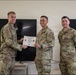 Senior Airman Terrell Blackwood, 377 SFS defender, is awarded the Superior Performer Award certificate during the inaugural Entry Controller Leaders Course graduation ceremony.