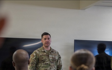 Senior Master Sgt. Gavin Saiz, 377 SFS senior enlisted leader, congratulate graduates of the inaugural Entry Controller Leaders Course during a graduation ceremony.