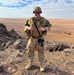 U.S. Army PAO Soldier poses at elevated desert outpost
