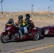 Marine and civilian personnel waved on veteran motorcycle riders with salutes and American flags along Route 66/Joseph L. Boll