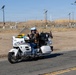Marine and civilian personnel waved on veteran motorcycle riders with salutes and American flags along Route 66/Joseph L. Bol